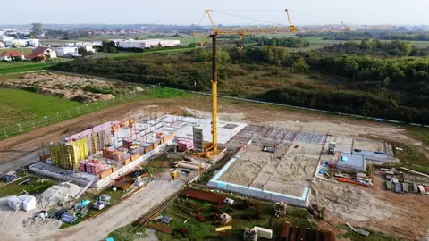 Aerial view of a construction site with a crane